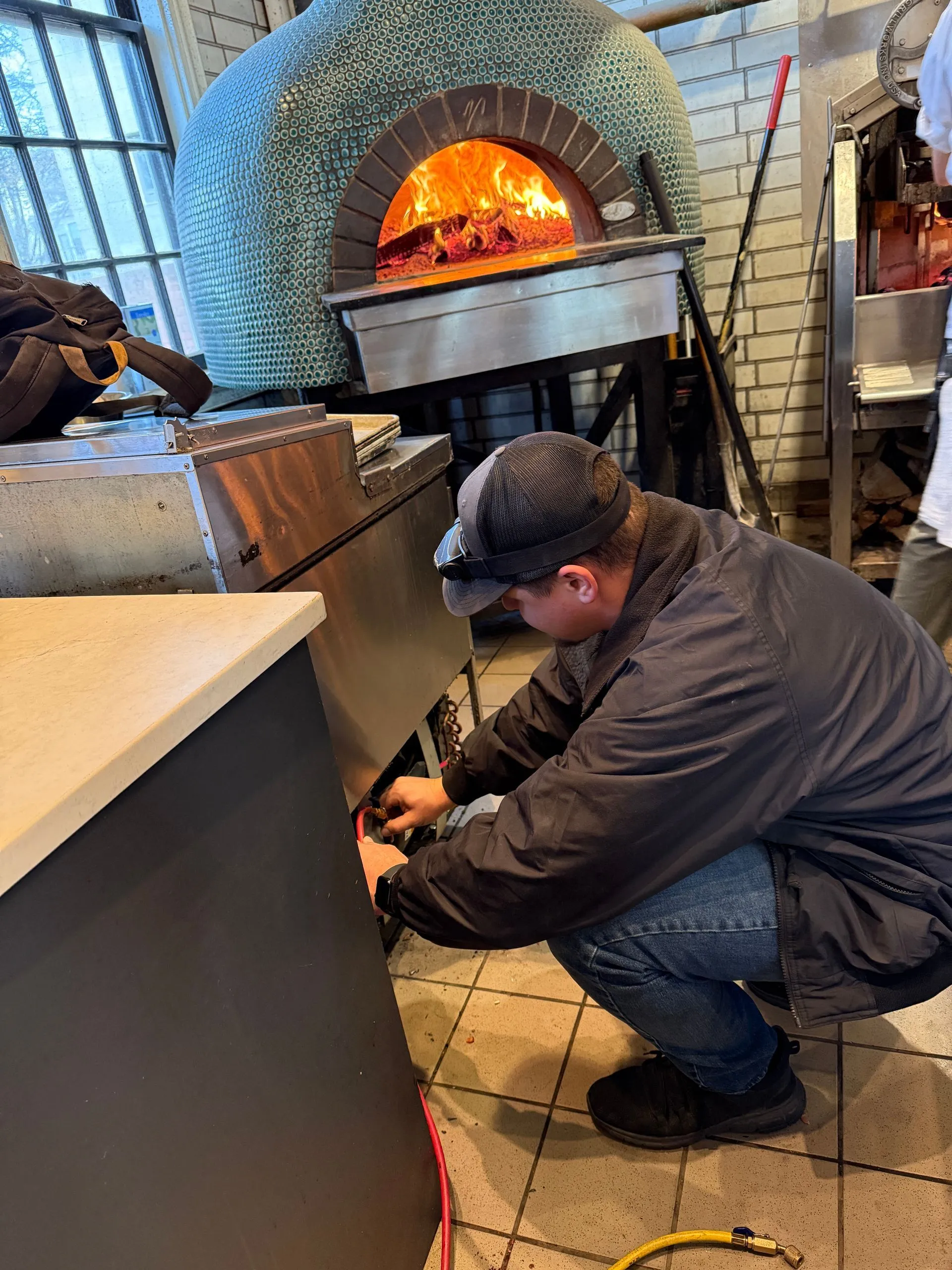 Technician in the field performing an appliance repair